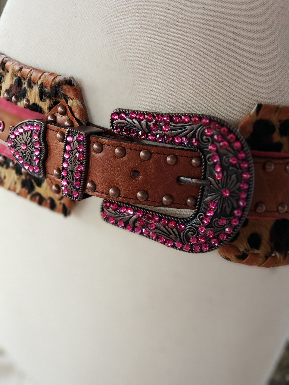 Kurtman Sassy Little Outlaw belt with leopard print, pink trim, brown studded strap and sparkling pink Western buckle