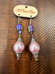 A Rare Bird blush pink pearl-look drop earrings with iridescent faceted beads and ornate silver-tone caps