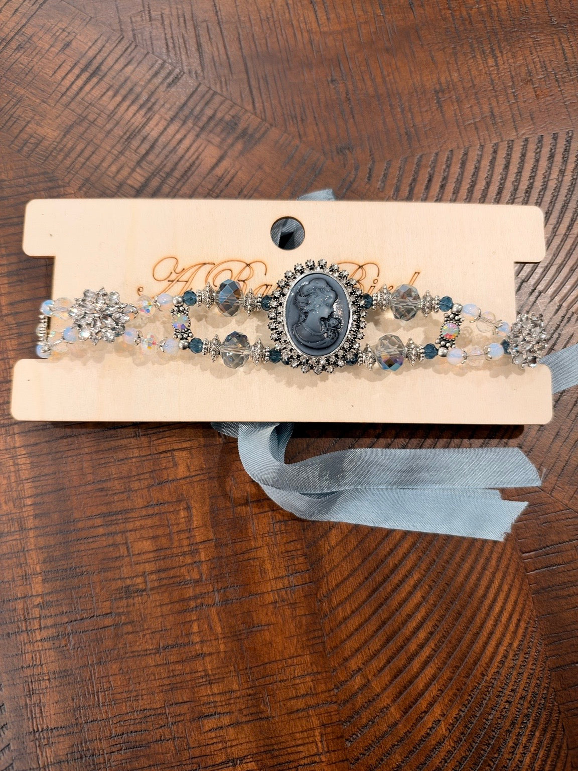 A Rare Bird Cameo Royale choker in Blue / Silver with faceted beads and blue ribbon