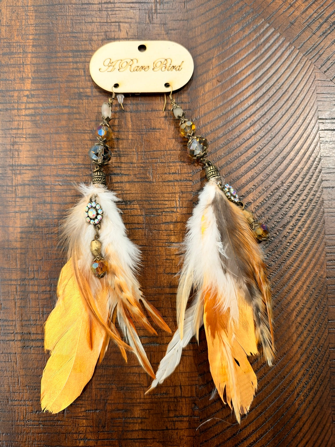 A Rare Bird long golden yellow, cream and brown feather earrings with faceted beads and sparkling accents