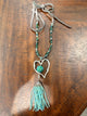 A Rare Bird Heartstrings necklace with silver-tone open heart and turquoise beaded tassel