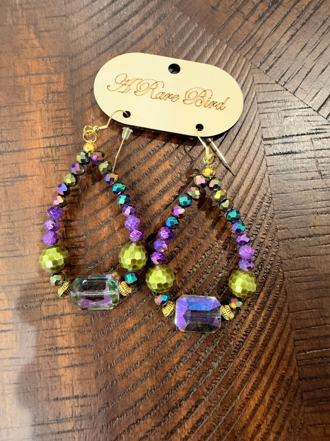 A Rare Bird purple and chartreuse beaded teardrop earrings with iridescent rectangular accents