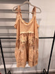 A Rare Bird peach floral eyelet dress with tie shoulders, tiered skirt, and star-print front pockets, front view
