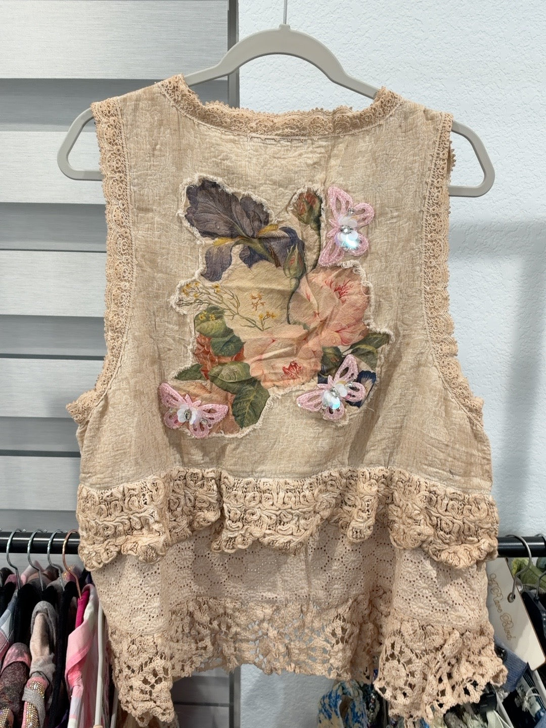 Pocket Full of Posies Vest back with floral applique, pink butterflies and layered lace hem