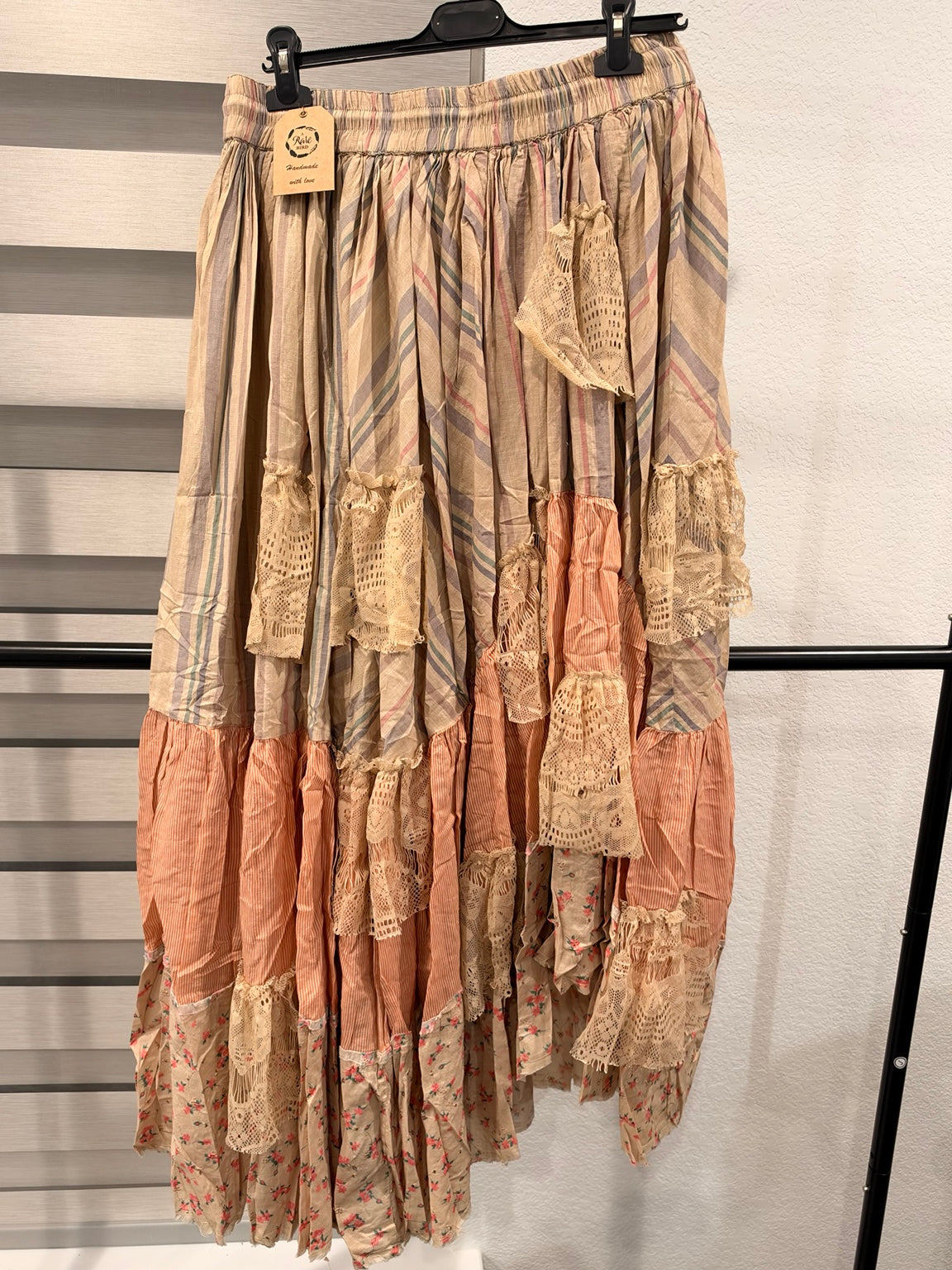 A Rare Bird Prairie Poetry patchwork skirt with muted stripes, peach panels, floral hem and cream lace, back