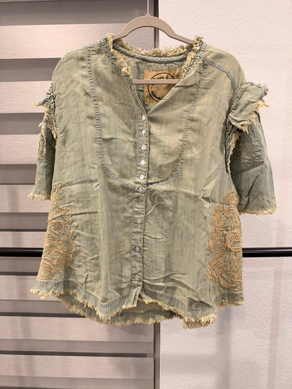 A Rare Bird sage green embroidered button-front top with ruffled sleeves and frayed edges, front view