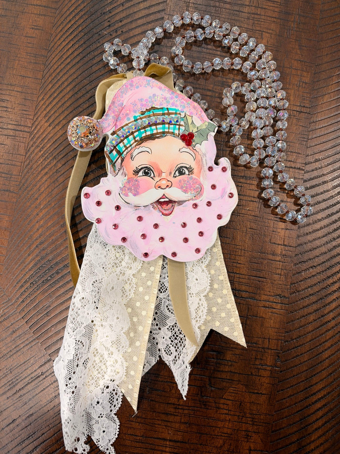 A Rare Bird pink Santa statement necklace with clear faceted beads, sparkling accents and lace ribbon fringe
