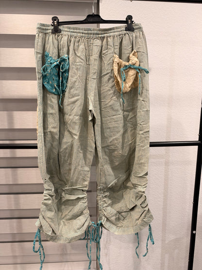 A Rare Bird women's turquoise star and striped patchwork pants with tie hems, back view