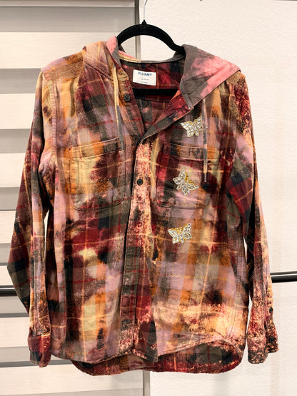 A Rare Bird Wild Darling Top in Rust Hooded Plaid, front with butterfly embellishments