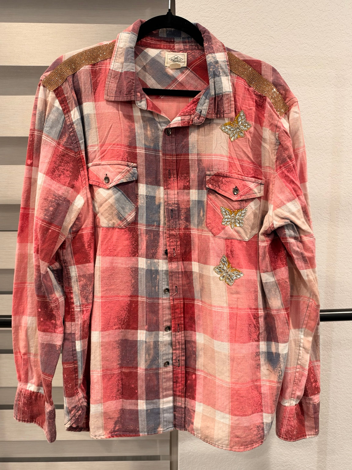 A Rare Bird Wild Darling Top in Coral Plaid, front with butterfly embellishments