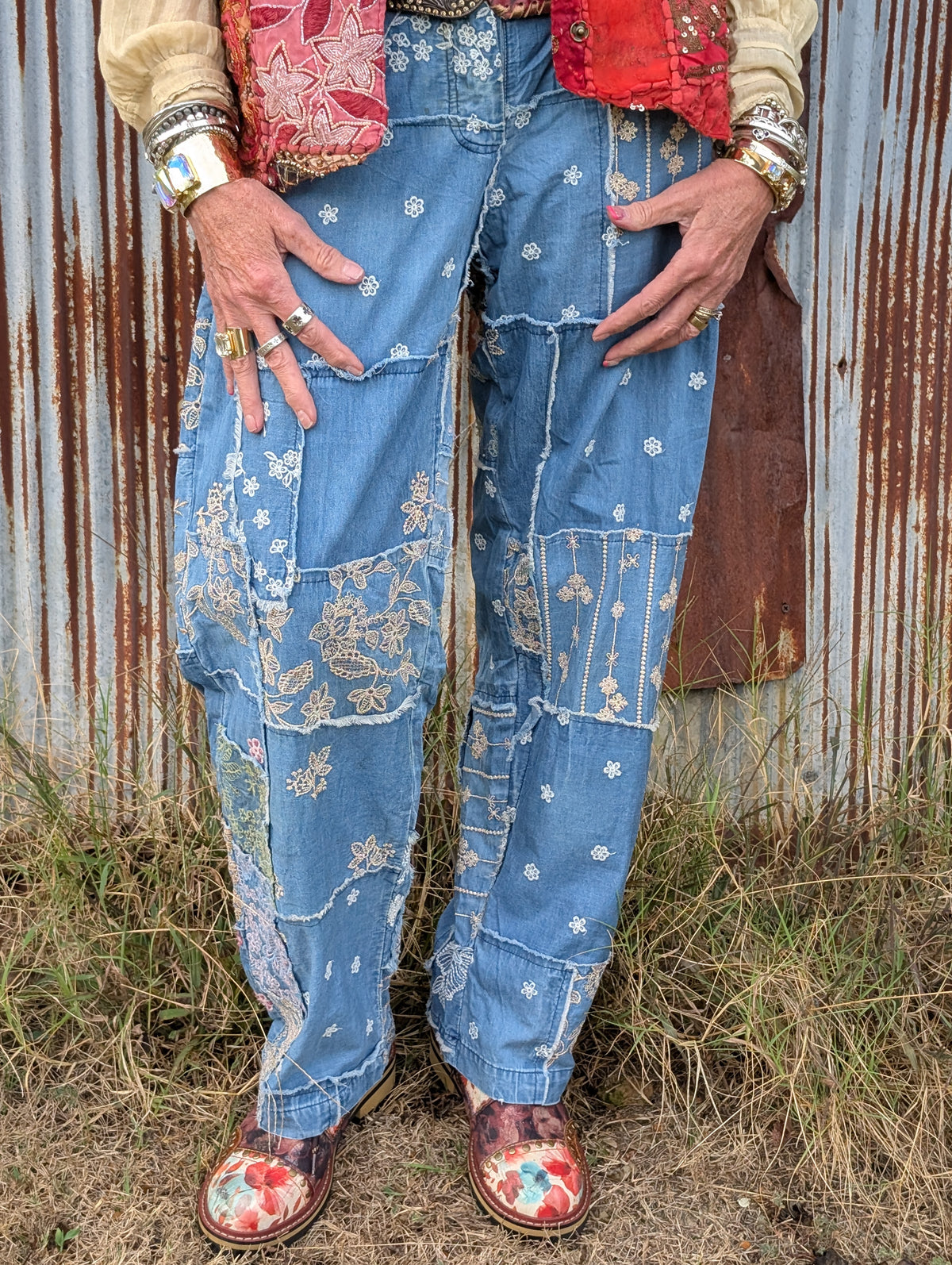 Bluebird Reverie Patchwork Pants — Felecia Bella by paper lace, front view showing blue patchwork panels, floral embroidery and frayed seam details.