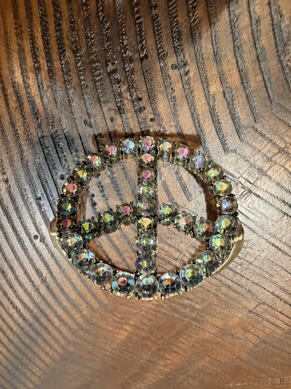 Upright gold-tone peace sign bracelet with smoky iridescent stones