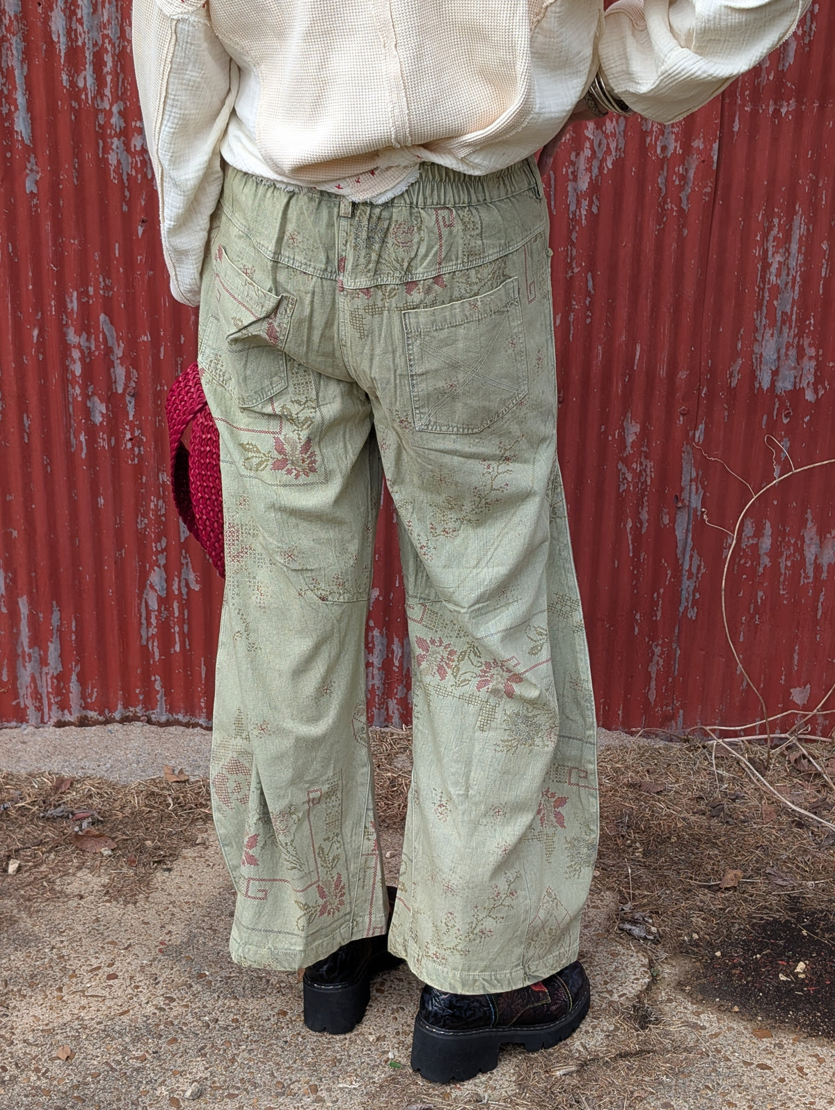 Back view of the Gilded Wishes Holiday Pants sample, showing patterned fabric, patch pockets and a gathered back waistband. Sample photo; finished ribbon will include gold thread and crystals.