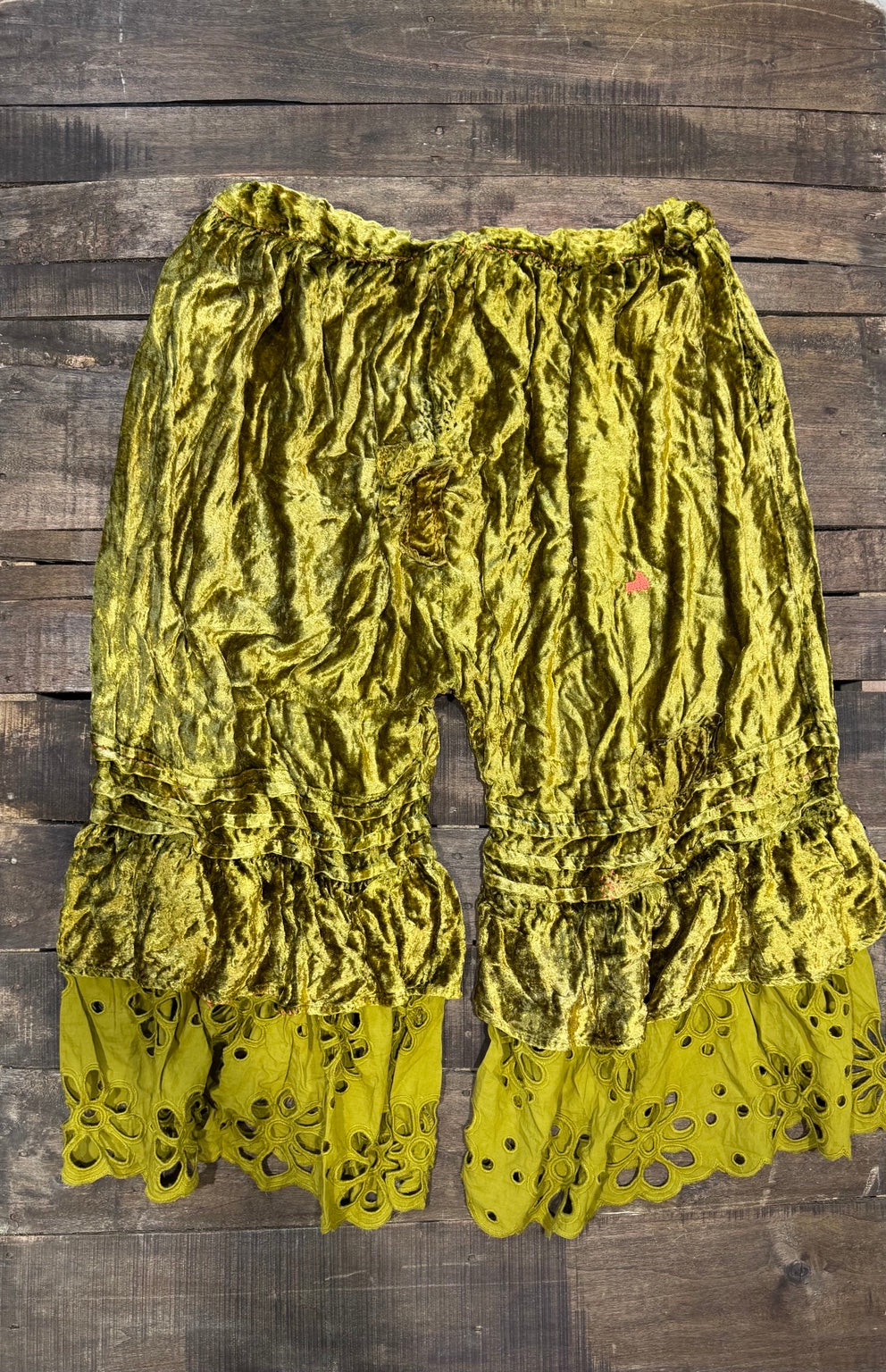 House of Jaded Gypsy chartreuse velvet-look pants with ruffles and floral eyelet hems, back