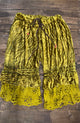 House of Jaded Gypsy chartreuse velvet-look pants with ruffles and floral eyelet hems, front