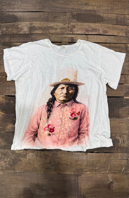 House of Jaded Gypsy white graphic tee, front with portrait in a pink floral shirt and hat