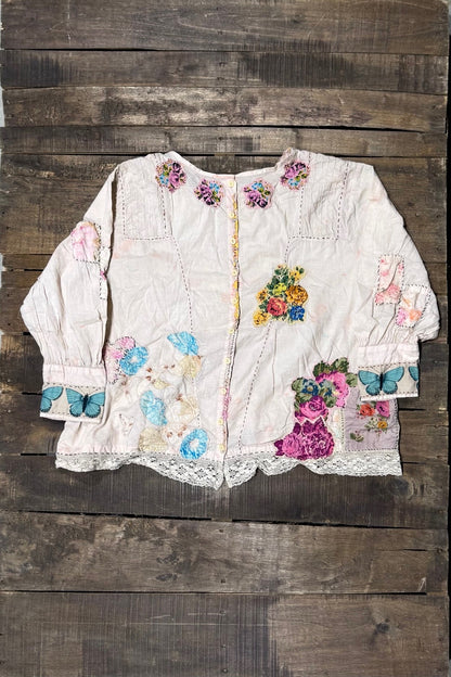 Buttoned back of House of Jaded Gypsy Gilded Bloom Top Flutter with floral patchwork details, butterfly cuffs and lace trim