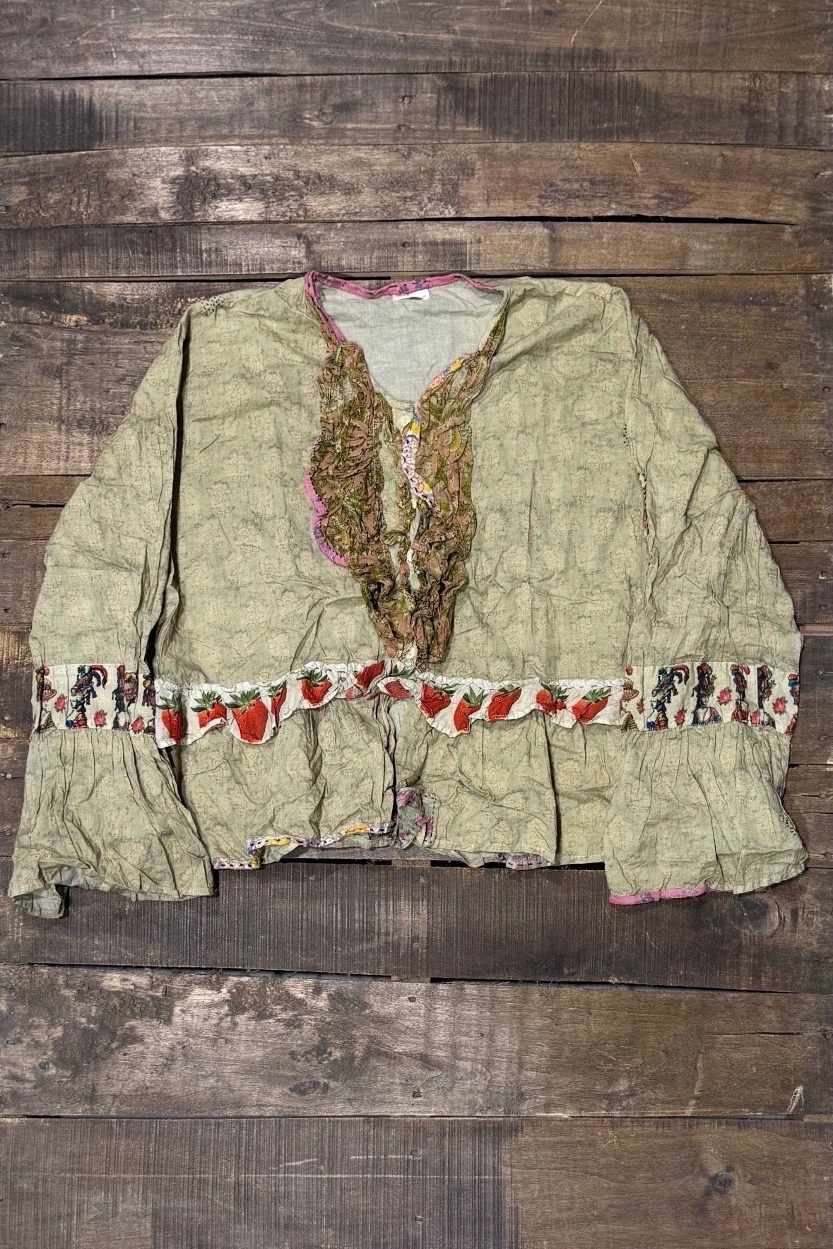 House of Jaded Gypsy Honey Bloom Top in Moss, front with patterned neckline ruffles, strawberry trim and flared cuffs
