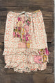 House of Jaded Gypsy Sun Spell Skirt in Canyon Glow, front with small floral print, colorful patchwork, waist tie and tiered ruffles