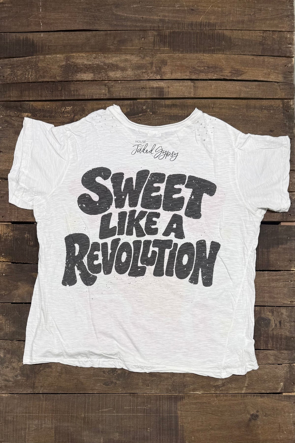 Back of House of Jaded Gypsy Weathered and Worn Tee Berry Sweet with bold black Sweet Like a Revolution lettering and brand logo