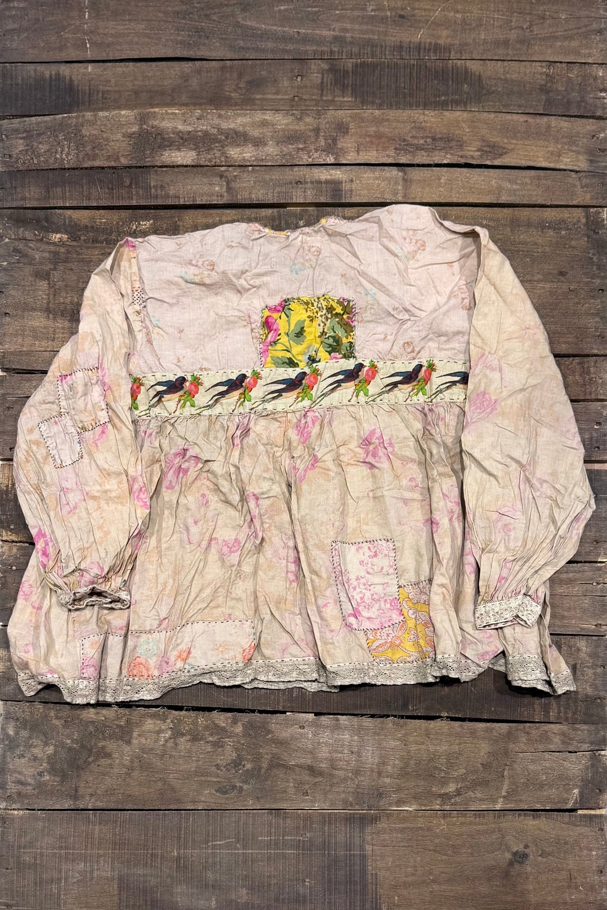 House of Jaded Gypsy Weathered Wildflower Top, back view with bird-and-flower band and floral patches