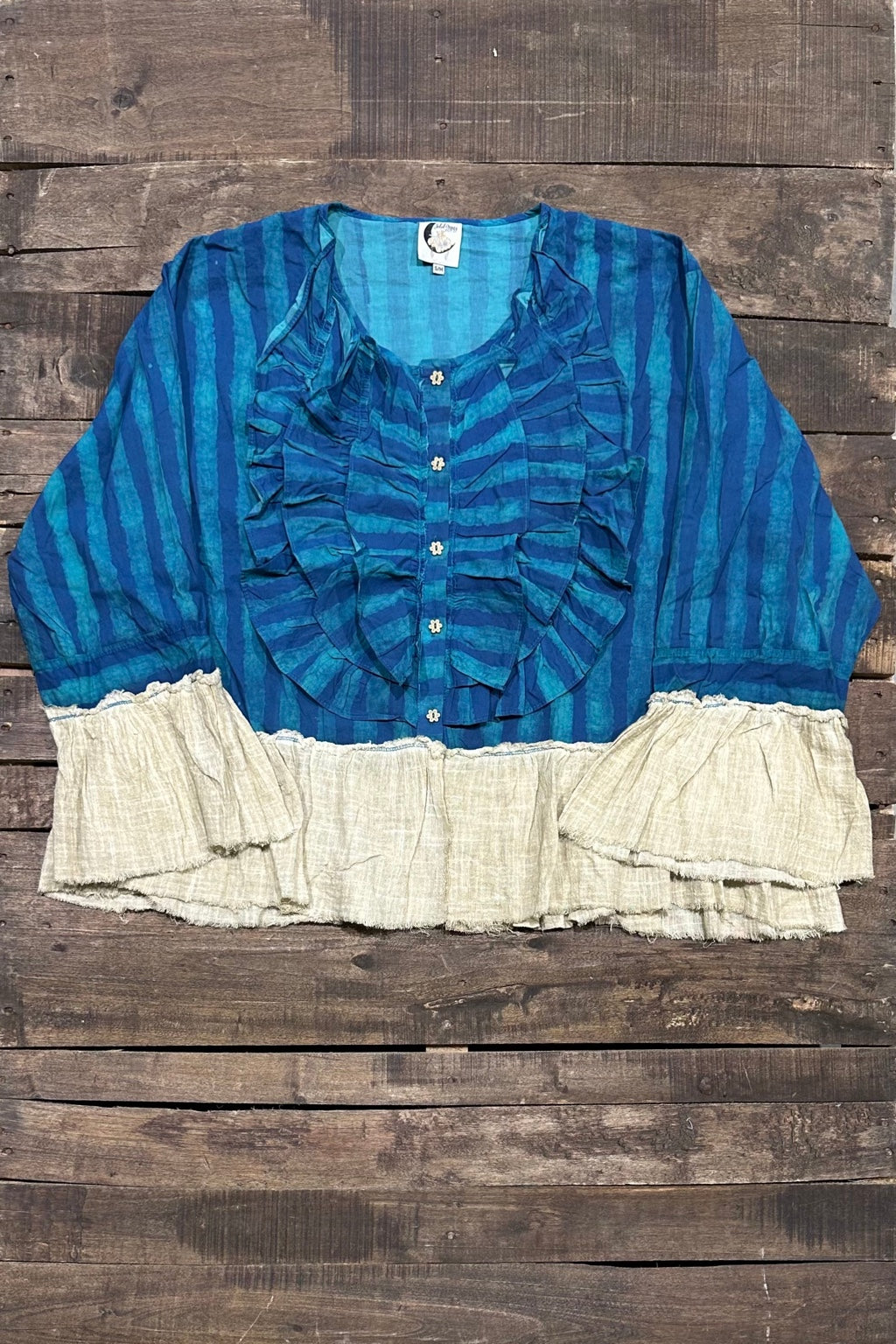 Jaded Gypsy Gentle Wander Top in blue and teal stripes with front ruffles and cream ruffled cuffs and hem