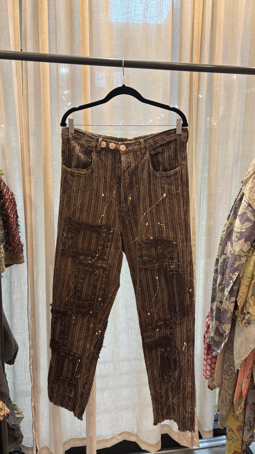 Traveling On Pants – Chocolate Stripe with distressed patches and paint-splatter accents