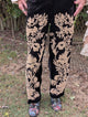 Midnight Wildflower Pants — Felecia Bella by paper lace, front view showing raised light-toned floral details against a dark background.
