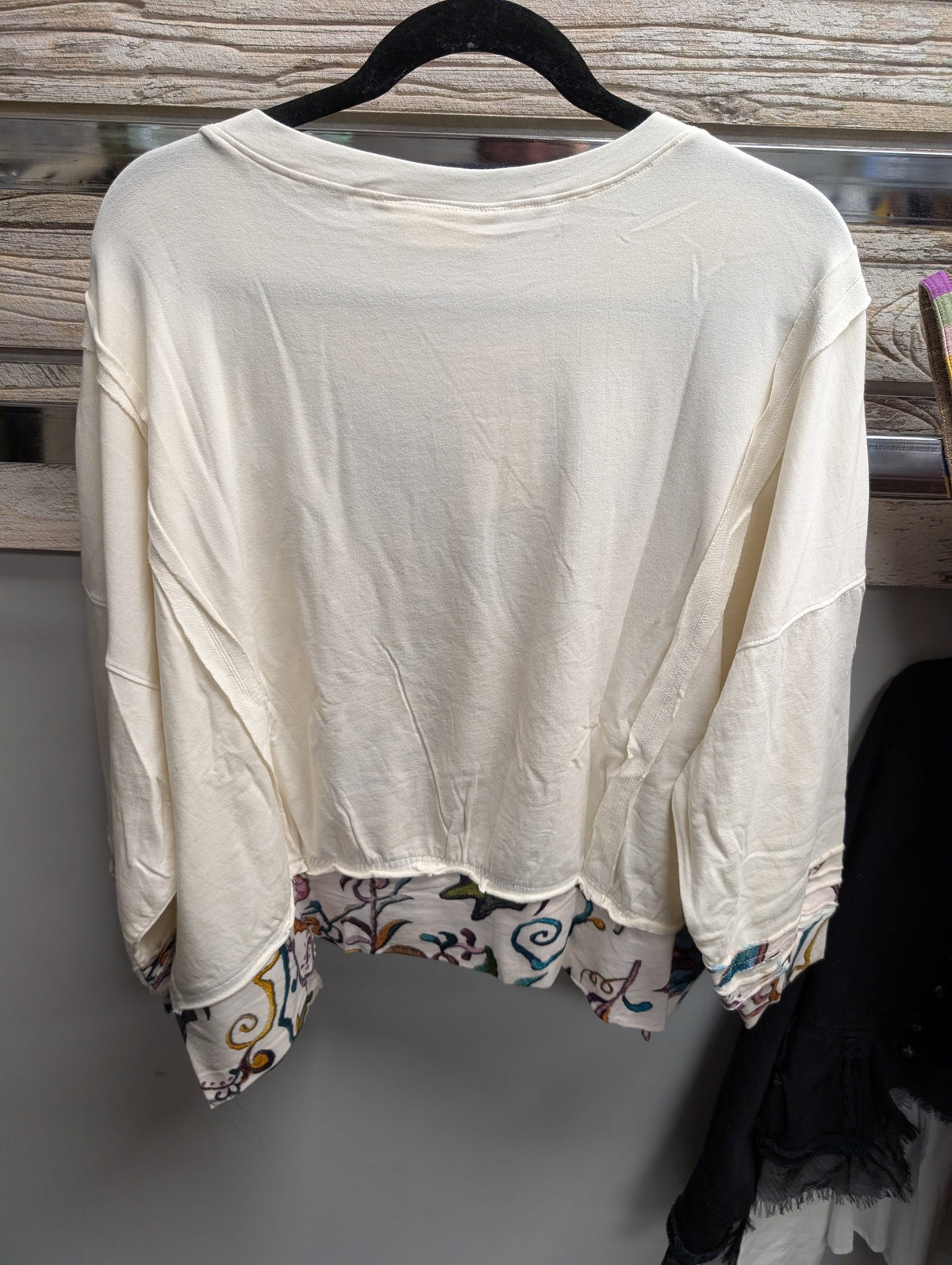 Back of Paper Lace off white pullover with floral hem and sleeve accents