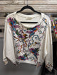 Paper Lace off white floral panel pullover with colorful flowers and scrolling vines, front