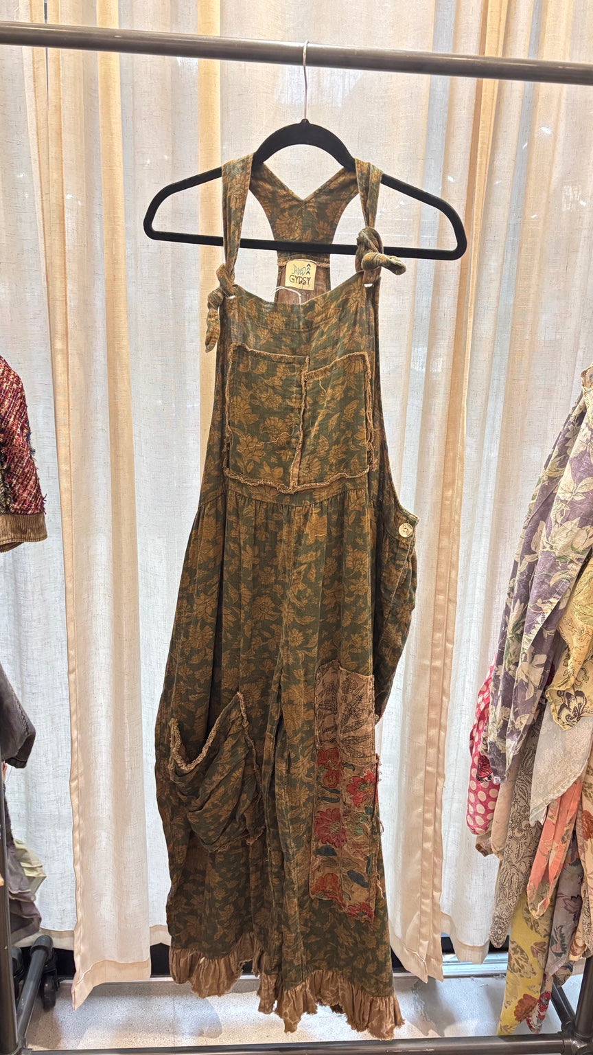 Jaded Gypsy Prairie Views Overalls Sage with floral print, knotted straps, patch pockets and ruffled hems