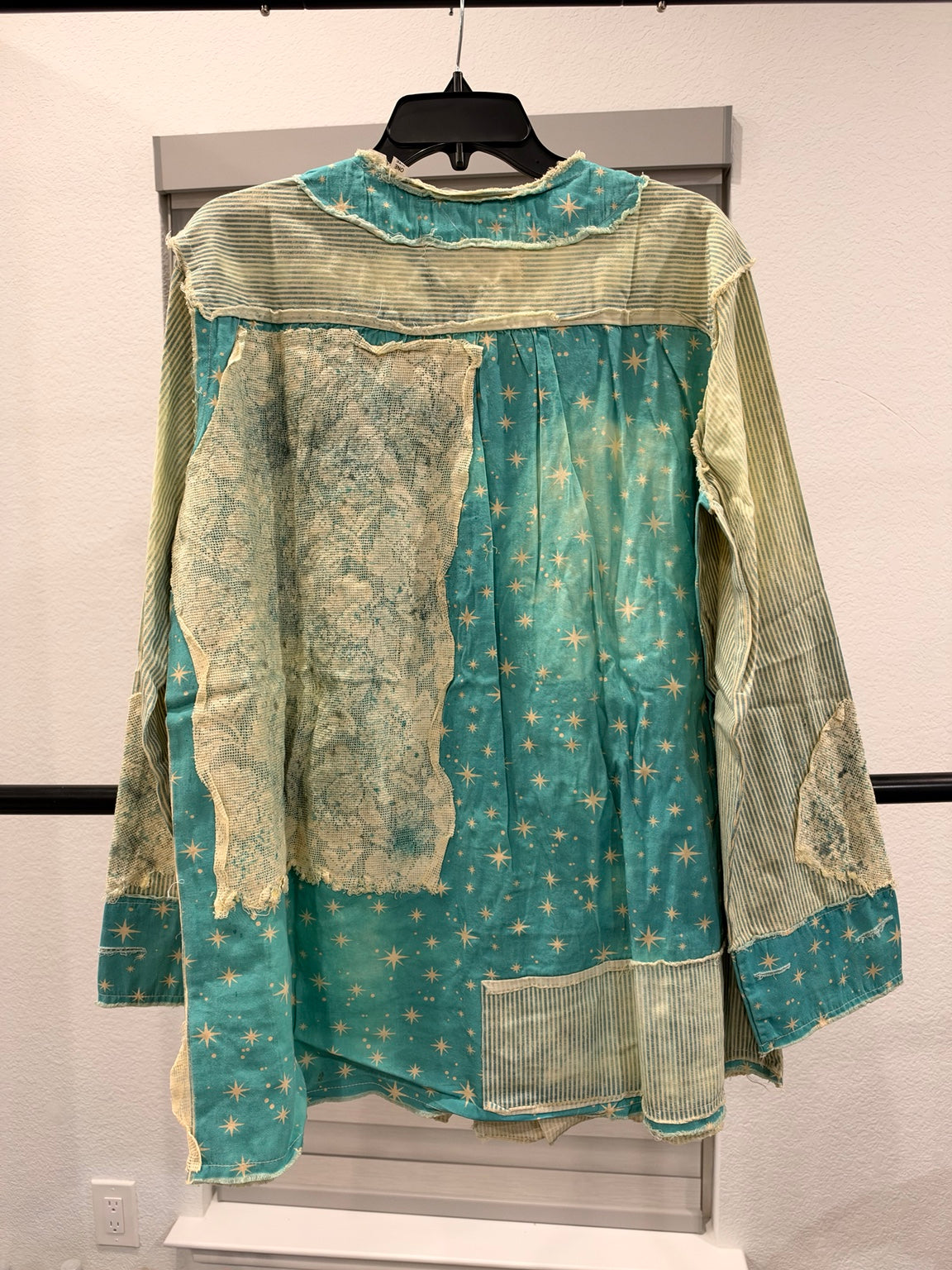 A Rare Bird turquoise star and stripe patchwork top, back