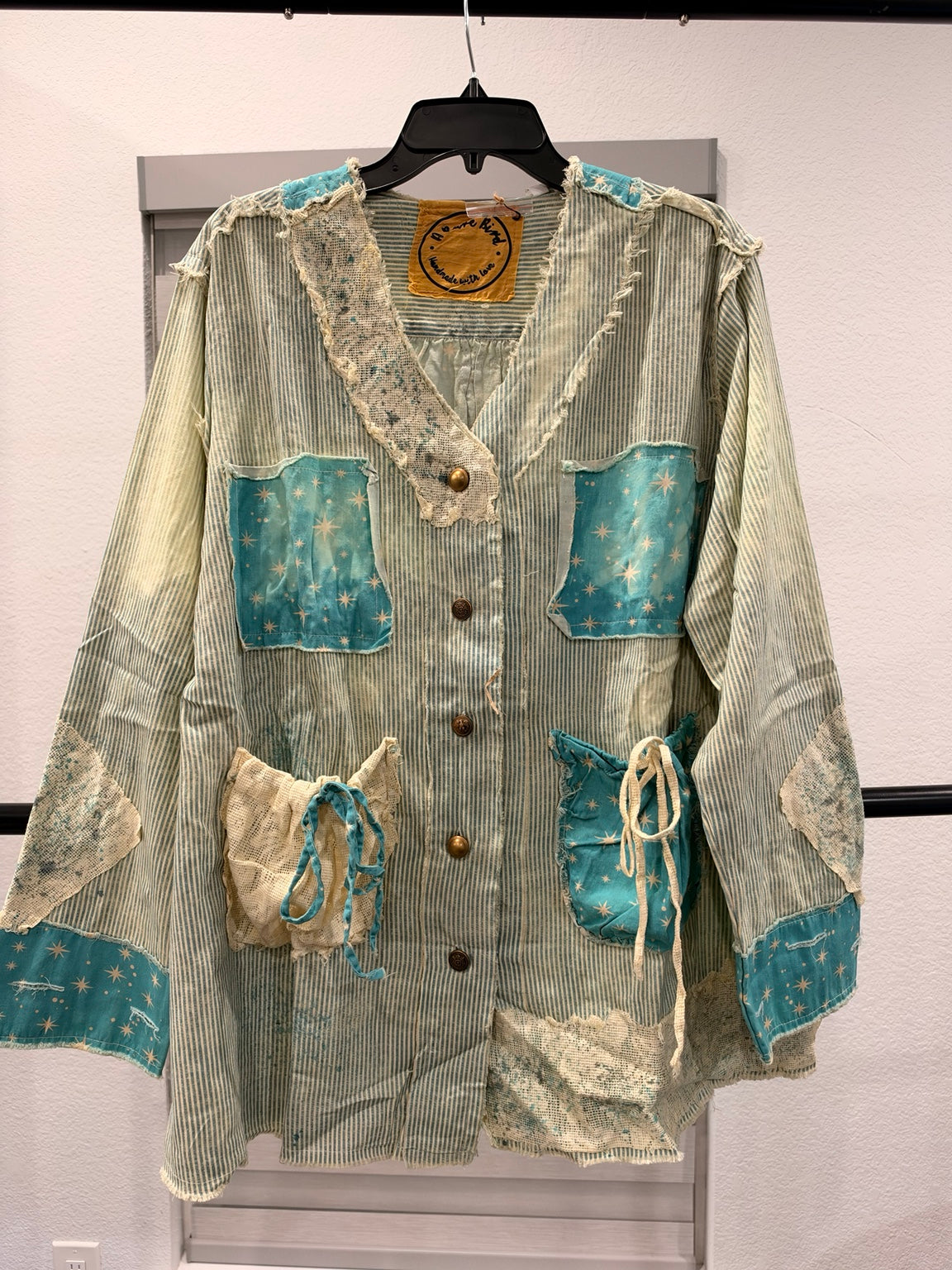 A Rare Bird turquoise star and stripe patchwork top, front