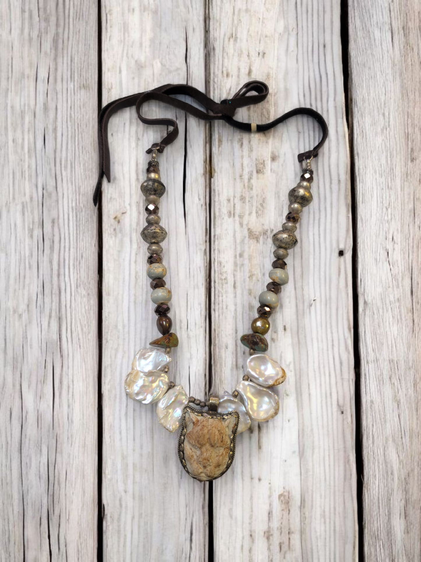 A Rare Bird Snow Leopard with pearls neckless