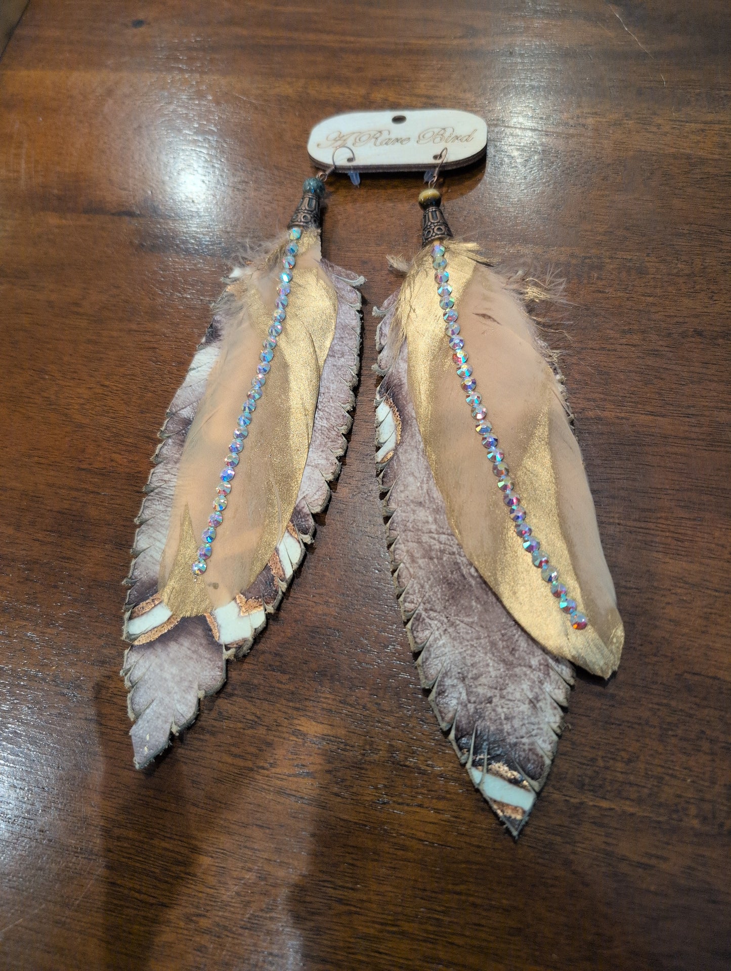 A Rare Bird Gold Leather Feather earrings