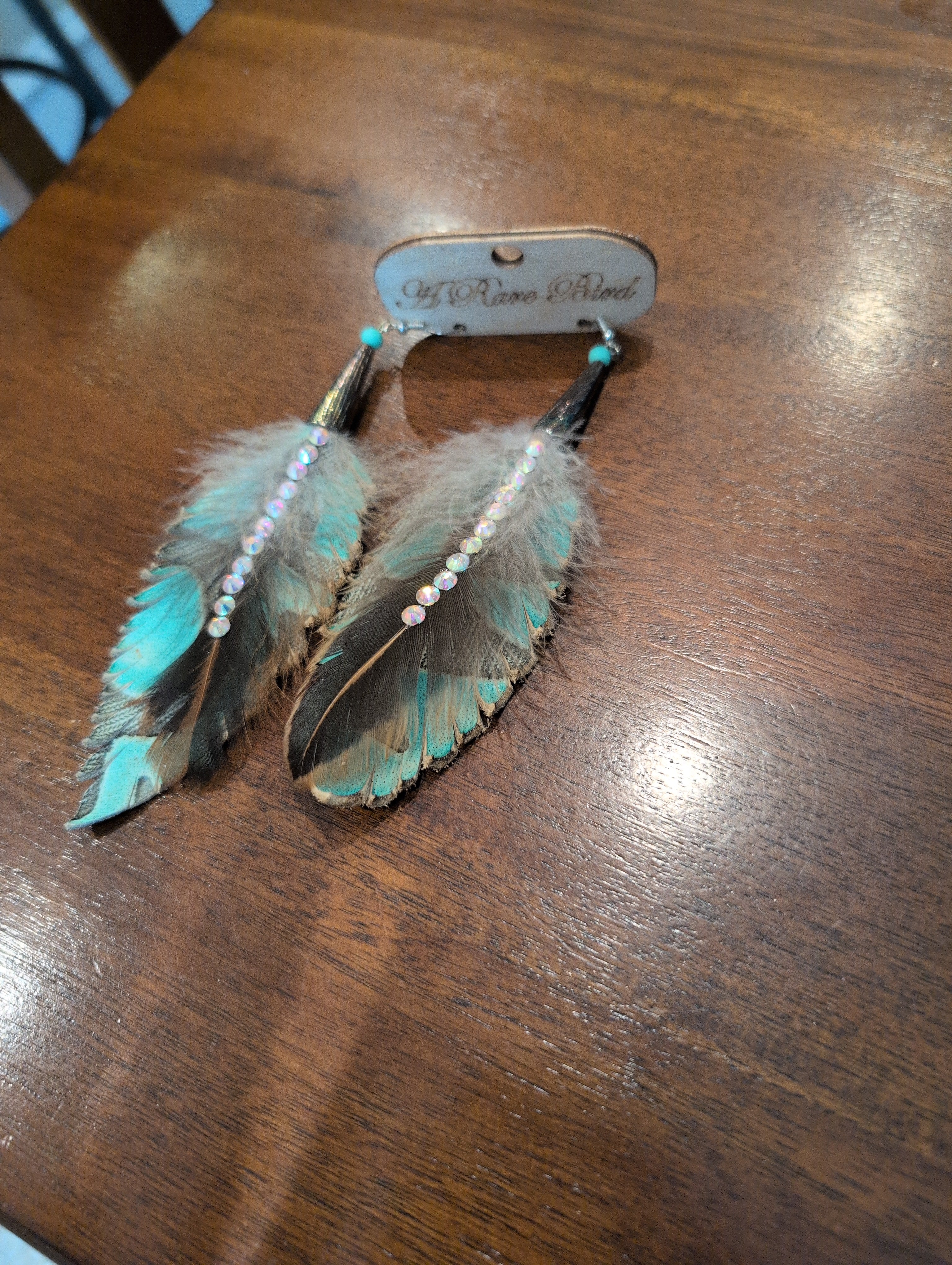 A Rare Bird Feahter turq blue ears