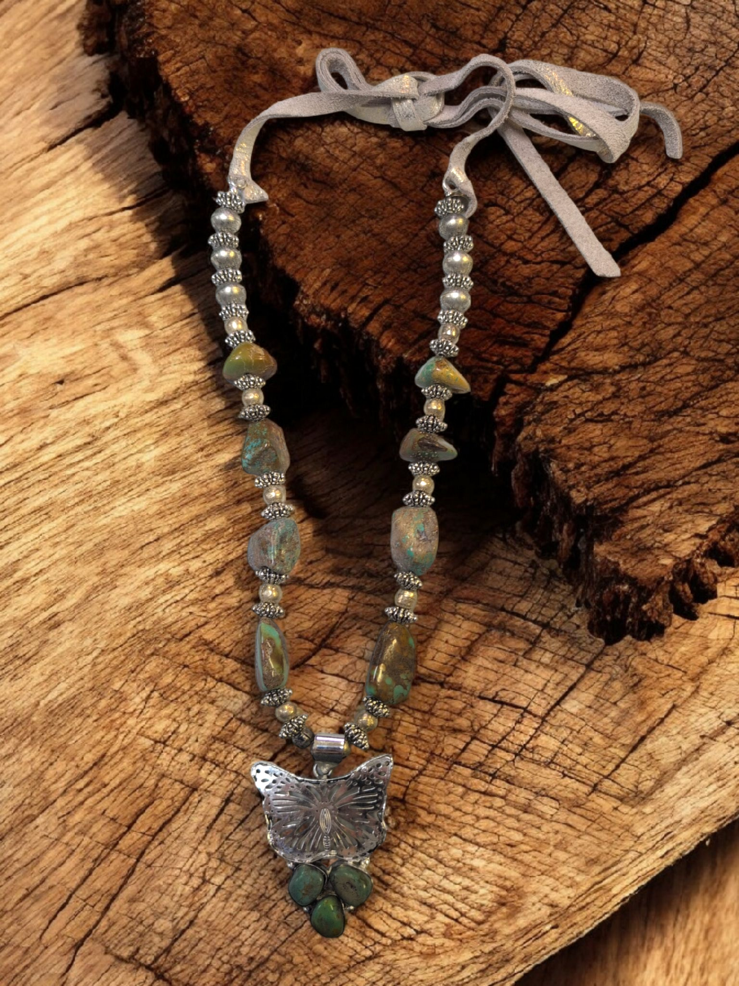 A Rare Bird Turqoise Butterfly  neckless