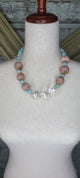A rare Bird Truq pink and crystal Necklace