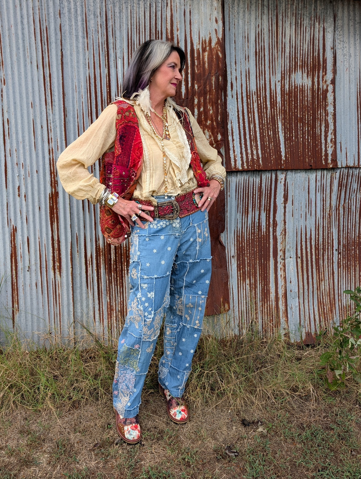 Scarlet Caravan Patchwork Vest — Felecia Bella by paper lace styled over a blouse with embroidered jeans, belt, shoes and accessories. Vest sold separately.