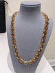 Wafa Amber Aura Crystal Necklace — solid amber-colored crystals in gold-tone settings