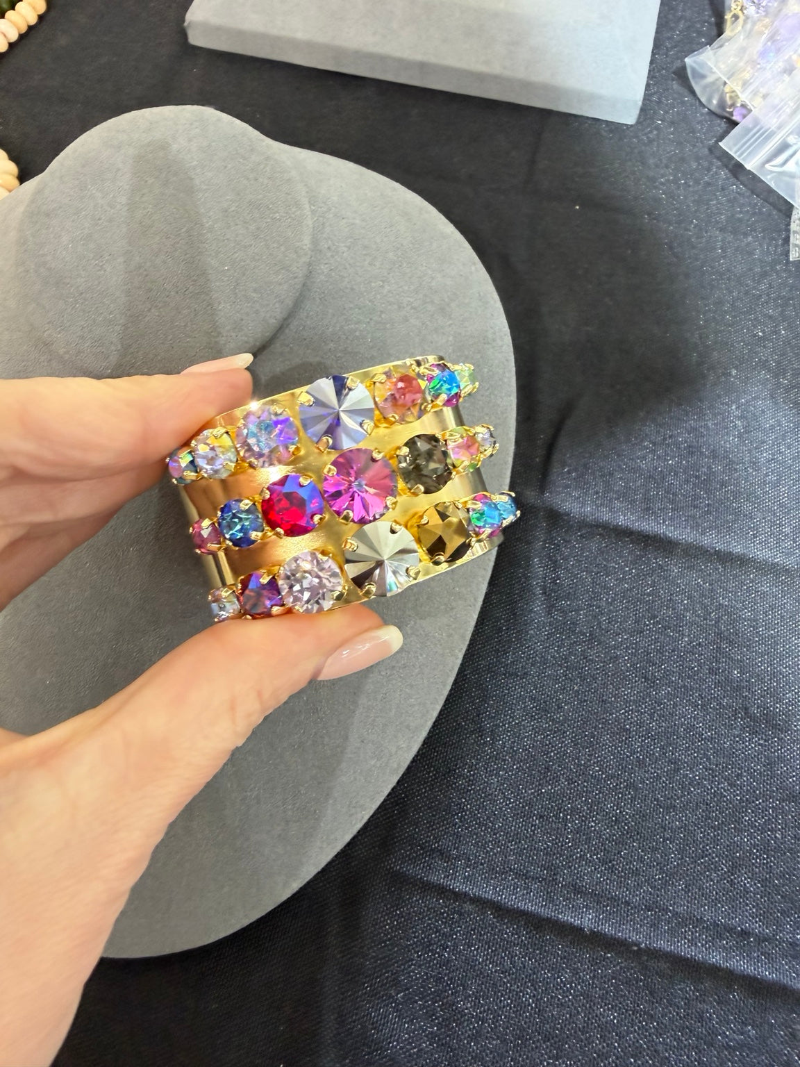 Gold-tone bangle with three rows of multicolor round crystals
