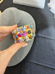 Gold-tone bangle with three rows of multicolor round crystals