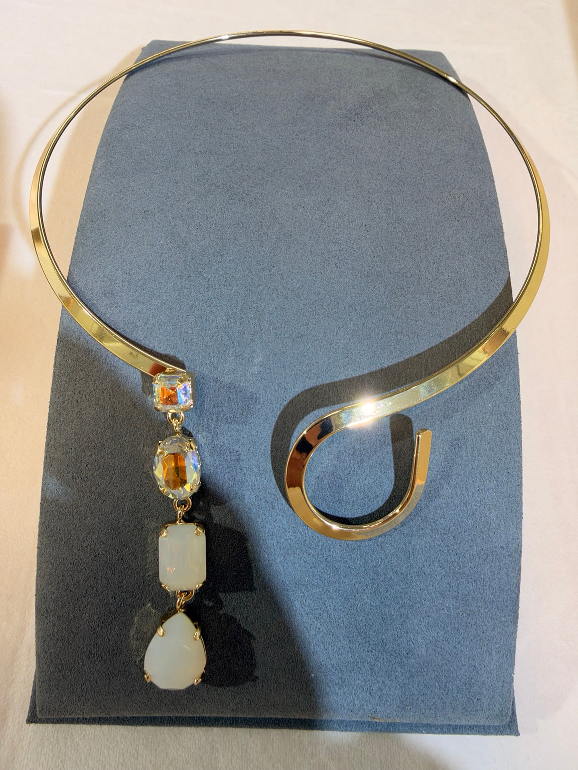 Wafa gold-tone open collar necklace with opalescent white and clear crystal drop