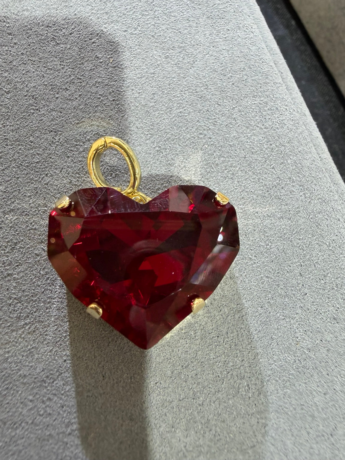 Ruby red crystal heart pendant with gold-tone setting