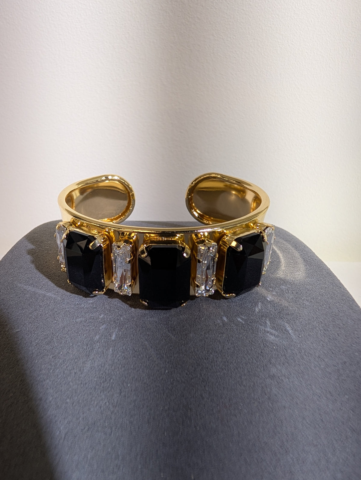 Wafa Midnight Baguette Cuff — Black/Clear, alternating black rectangular and slim clear accents on a gold-tone cuff