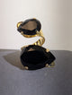 Wafa Midnight Duo Ring — Black, with two teardrop-shaped accents on a curved gold-tone band