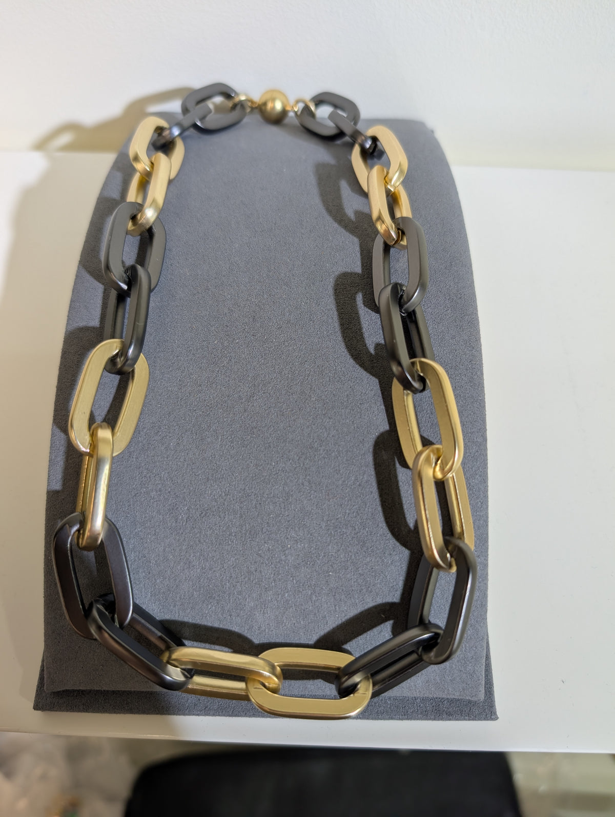 Wafa Midnight Gold Link Necklace — oversized dark gray and gold-tone rectangular links