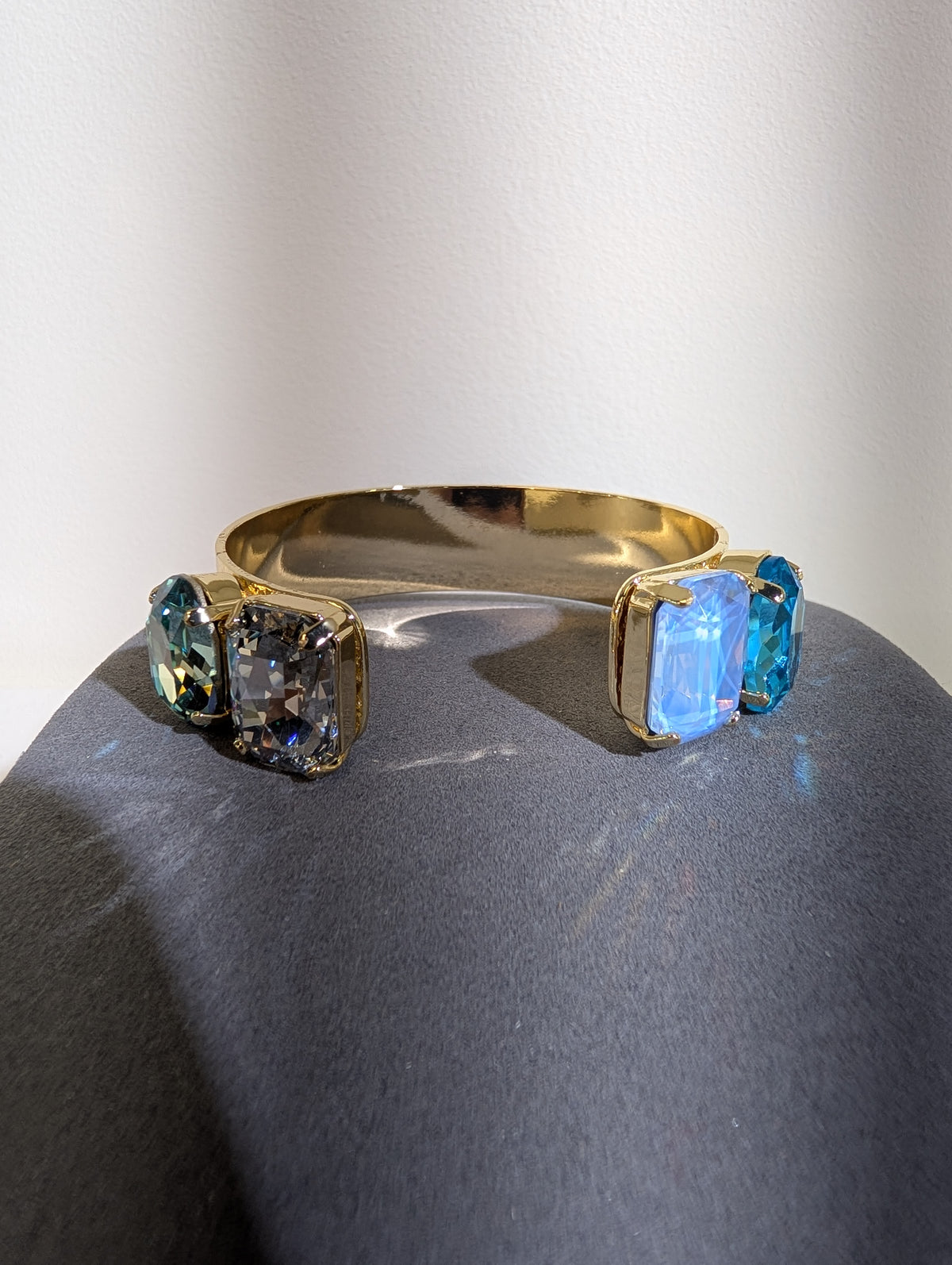Wafa Ocean Glow Cuff — Blue Mix, with oval and rectangular accents on an open-front gold-tone band