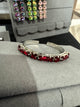 Red crystal open cuff bracelet in silver-tone settings