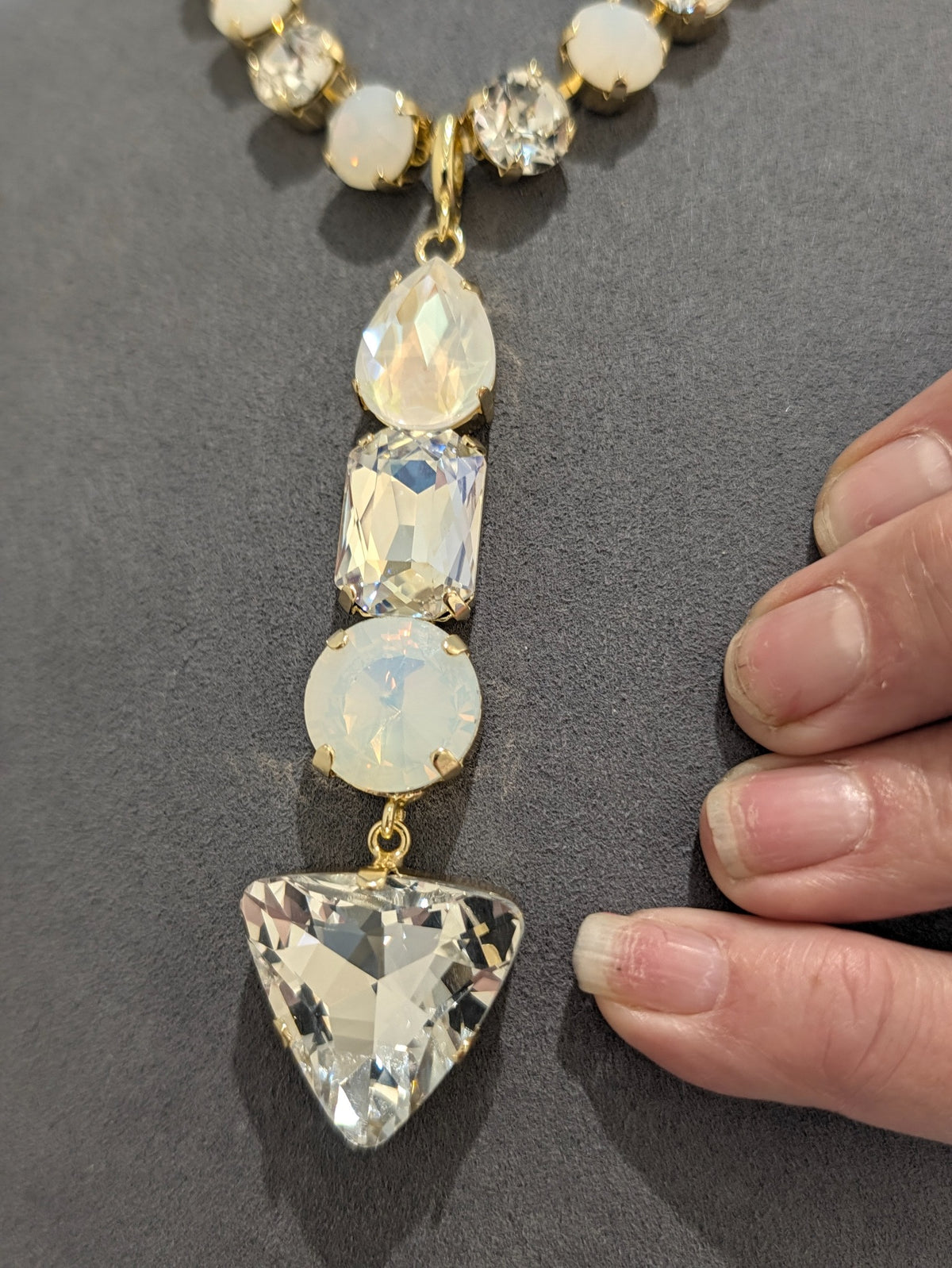 Twilight Prism lariat pendant, white opal and clear crystals in gold tone; necklace sold separately